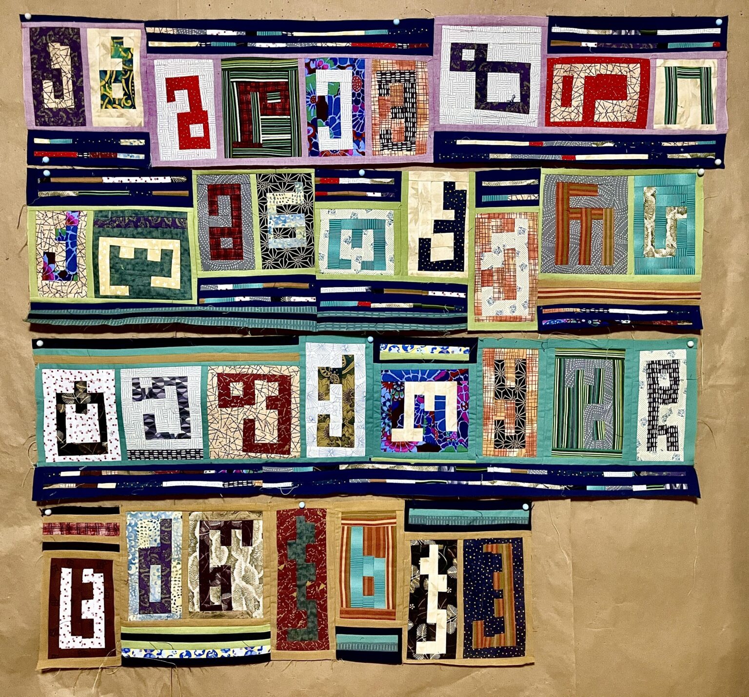Sewing a quilt of the Georgian alphabet!
