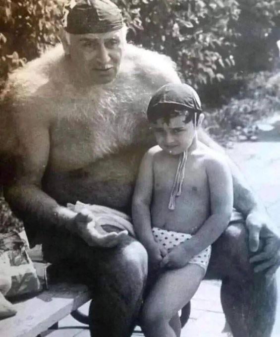 Soviet water polo player, Petre Mshvenieradze with his grandson in the 1990s.