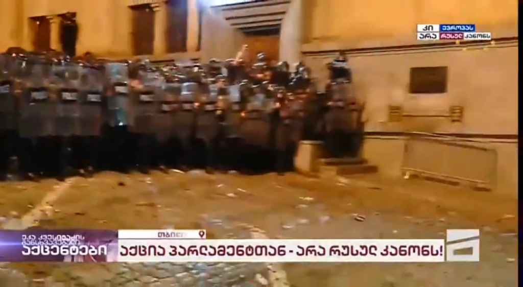 Shooting at protesters with plastic bullets...