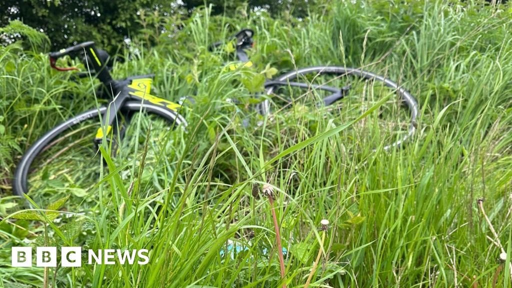 Cyclist pushed off bike near Ashington by passenger in passing BMW.