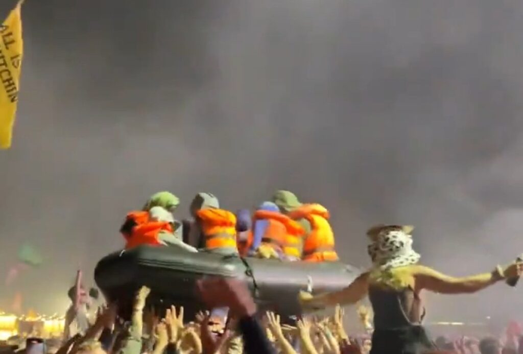 Banksy let loose inflatable boat with dummy migrants at Glastonbury Idles set Banksy let loose inflatable boat with dummy migrants at Glastonbury Idles set