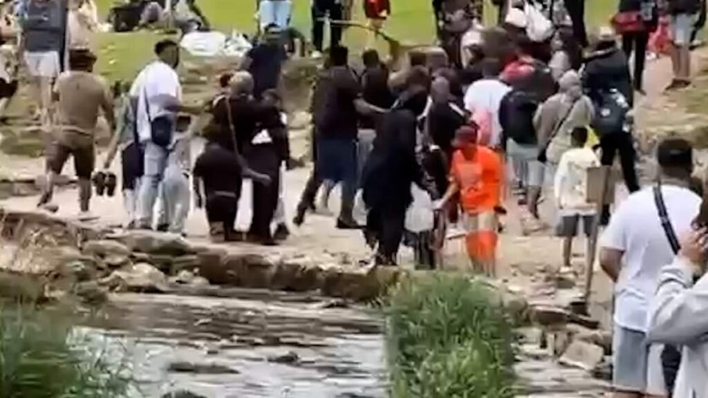 Moment huge brawl erupts at Dovedale stepping stones beauty spot as people hurl large sticks at each other Moment huge brawl erupts at Dovedale stepping stones beauty spot as people hurl large sticks at each other