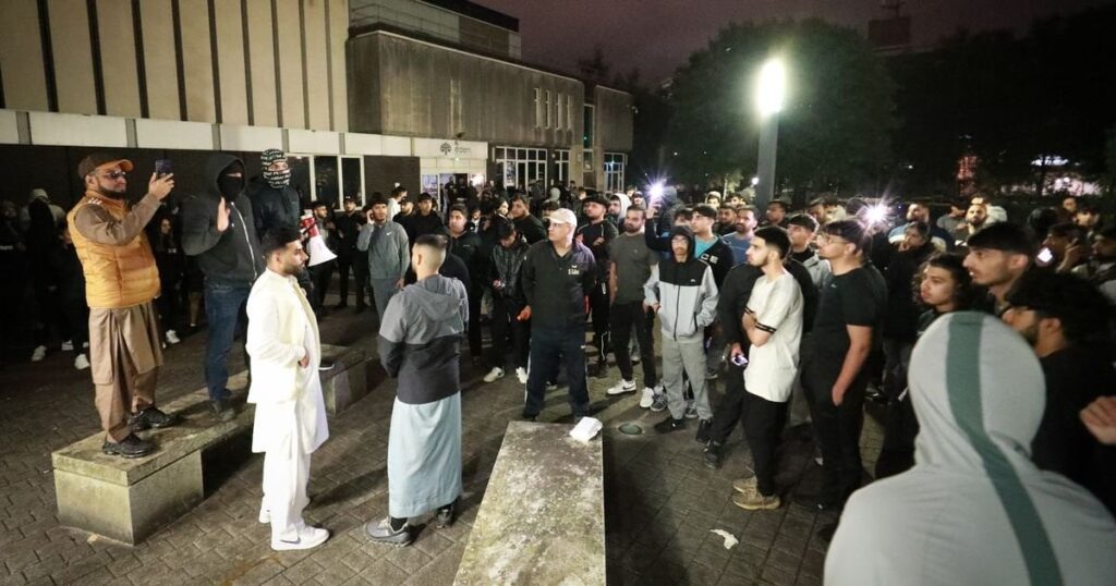 Hundreds gather outside police station over video of officer kicking man in head