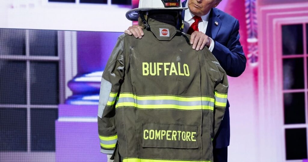 Trump stands next to uniform of volunteer firefighter killed at rally with misspelled name on jacket