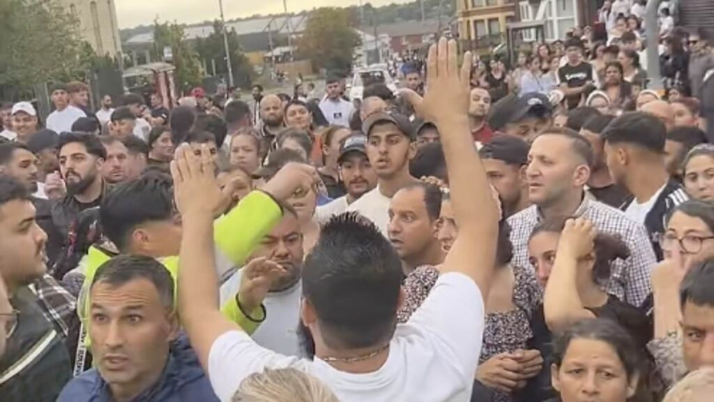 Chaos in Leeds after huge gang of thugs overturns a police car and riots on the street causing dozens of units to swarm area