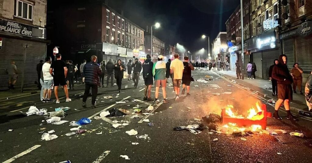 Shops looted and library torched as 'sickening' violence erupts in Liverpool