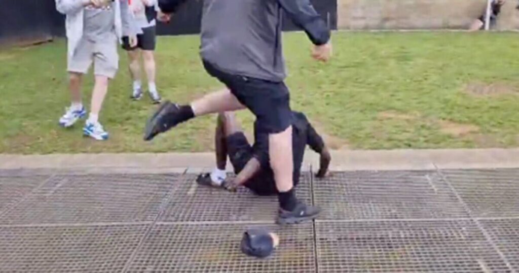 Sickening footage shows thugs kick and punch black man to floor as chaos erupts