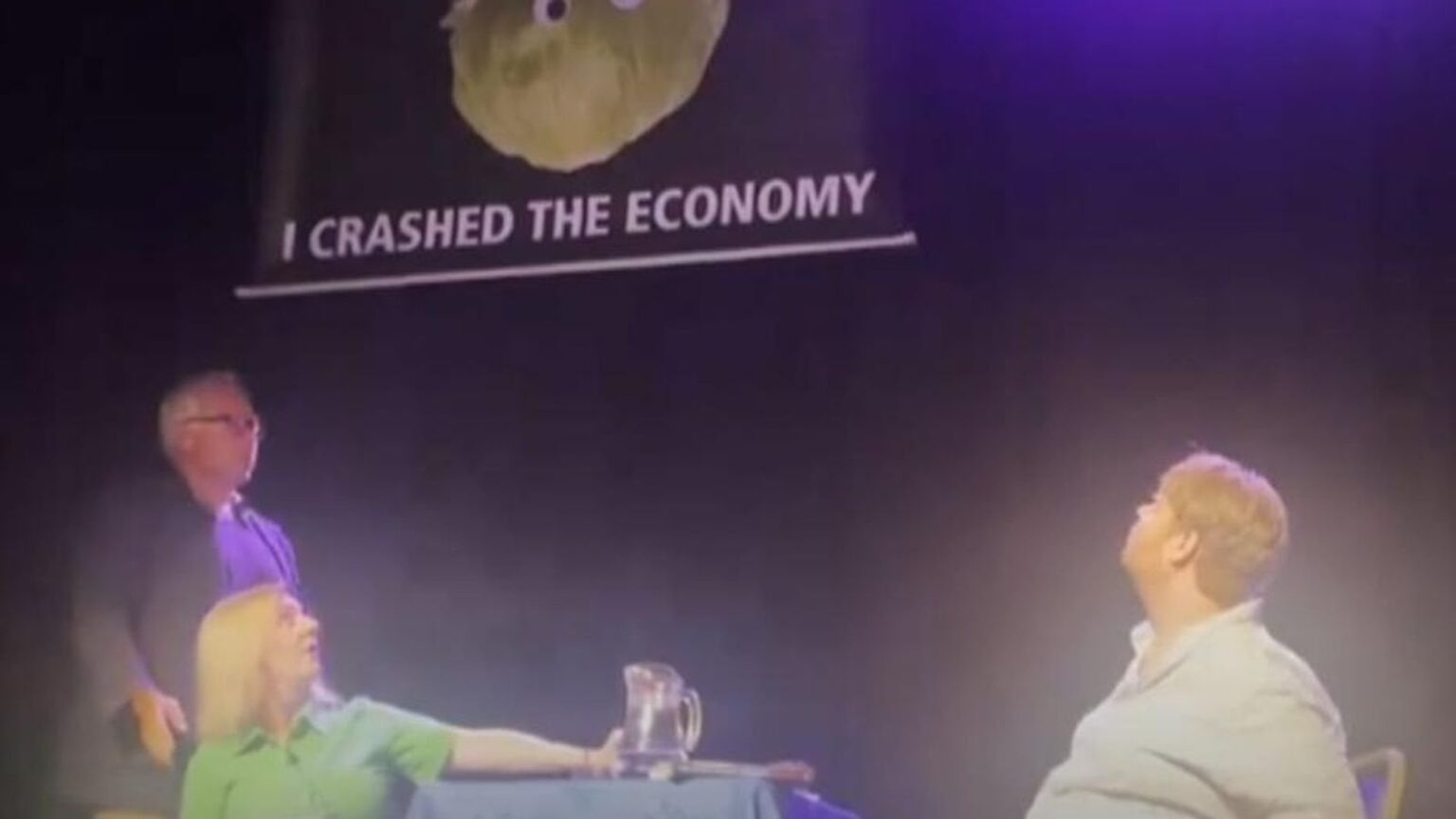 Liz Truss event interrupted by banner depicting a lettuce