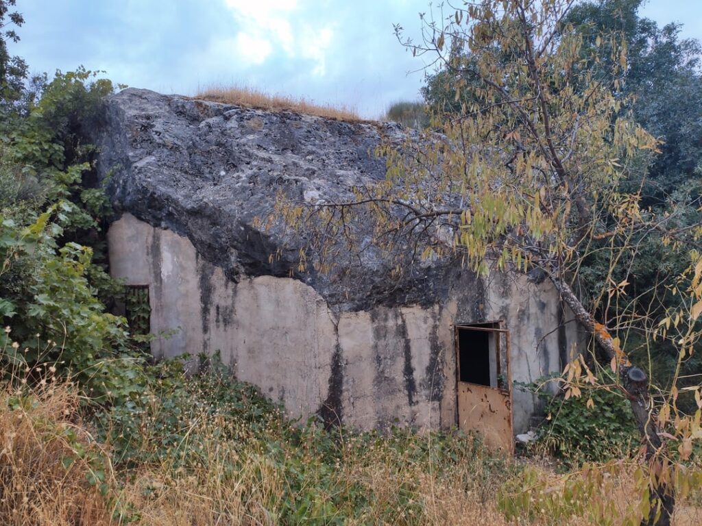 I discovered an ancient construction under the rock on a nature walk.