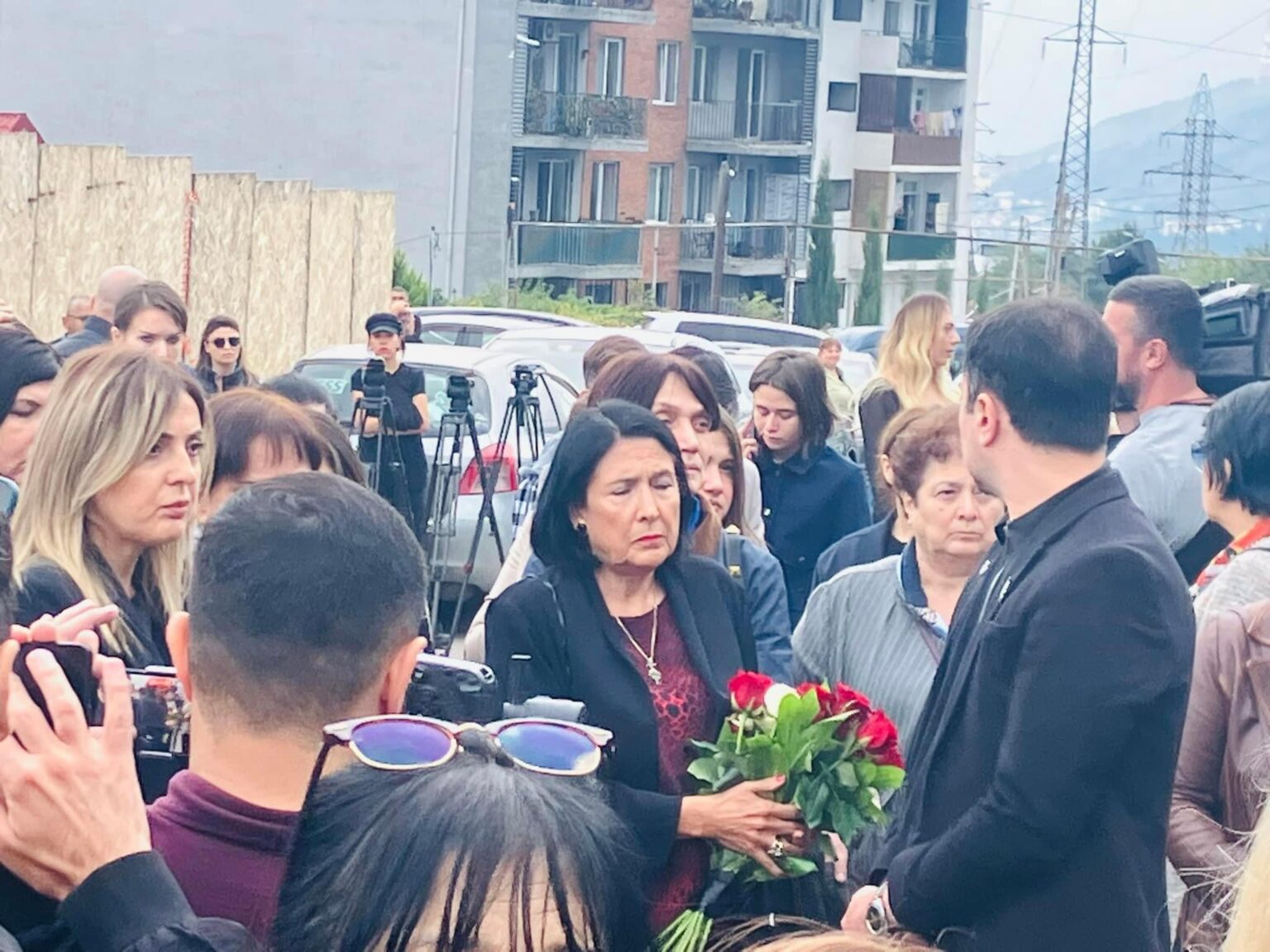 The President of Georgia seen at the funeral of Kesaria Abramidze - a famous Georgian trans girl murdered a couple of days ago