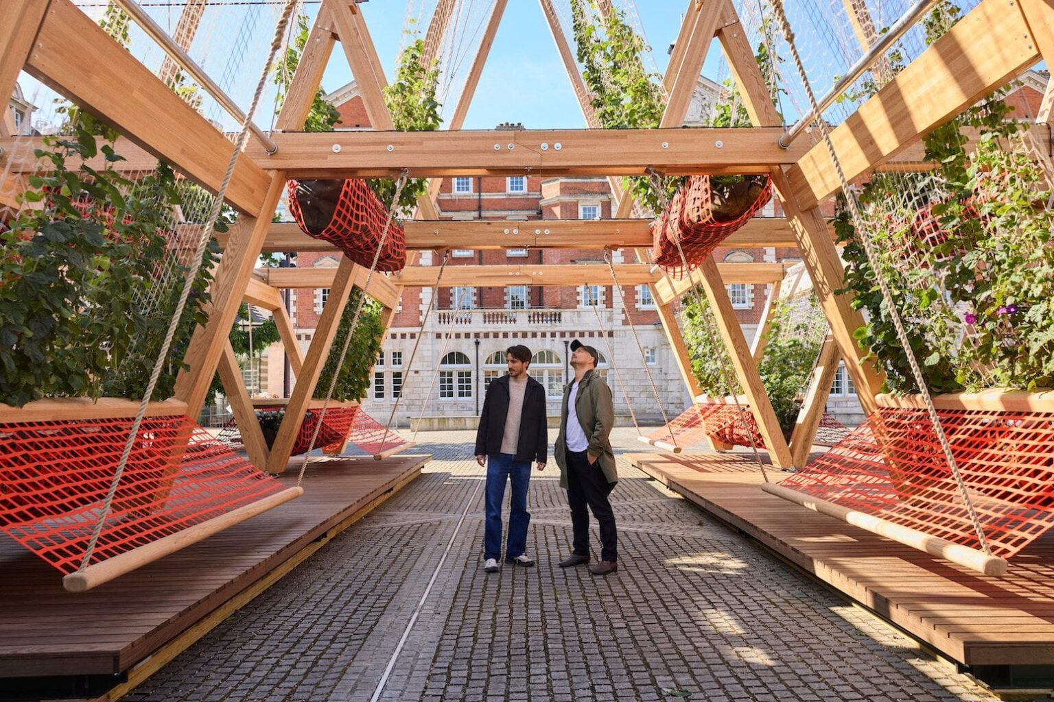 The 'greening machine' project, Vert, shows how small urban spaces can quickly get all the benefits of large old trees with 'pop-up parks' using soil pots, wooden structures and climbing plants.