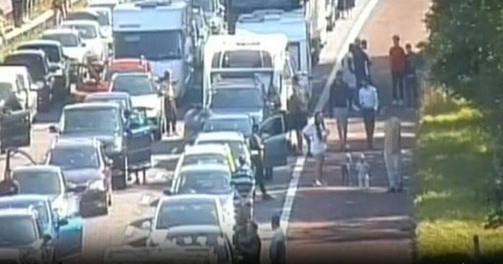 Chaos on M6 as drivers abandon cars to play football during traffic jam