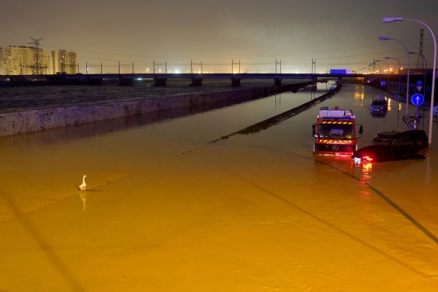 Cars are trapped by flooding in Valencia, Wednesday, Oct. 30, 2024. (AP Photo/Alberto Saiz)