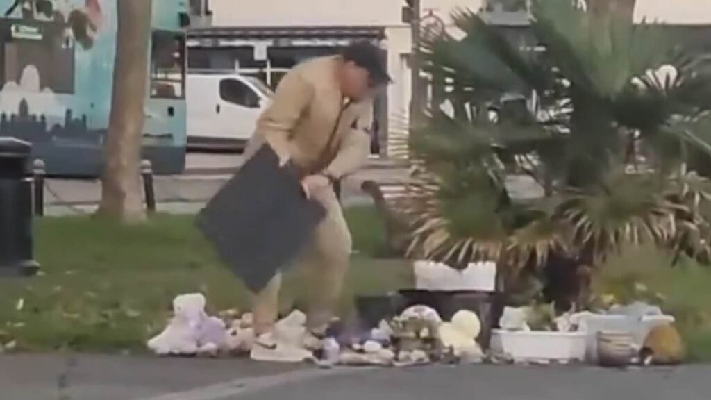 Moment an 'evil old man' destroys an October 7th anniversary memorial in Brighton sparking outrage