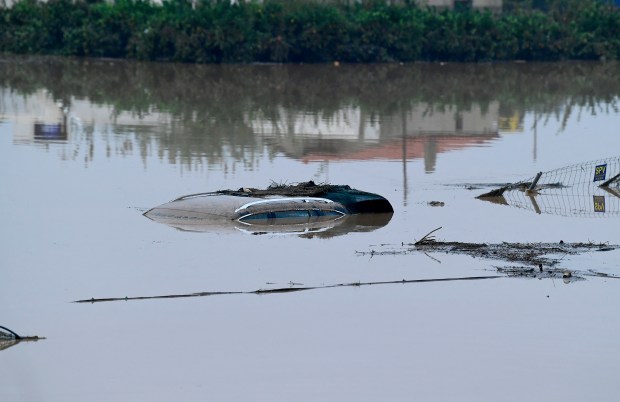 The roof of a car submerged in water following floods is pictured in Picanya, near Valencia, eastern Spain, on October 30, 2024. Floods triggered by torrential rains in Spain's eastern Valencia region has left 51 people dead, rescue services said on Wednesday. (Photo by Jose Jordan / AFP) (Photo by JOSE JORDAN/AFP via Getty Images)