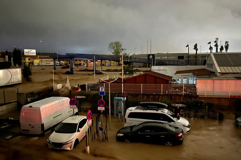 Cars submerged in floodwater in Valencia