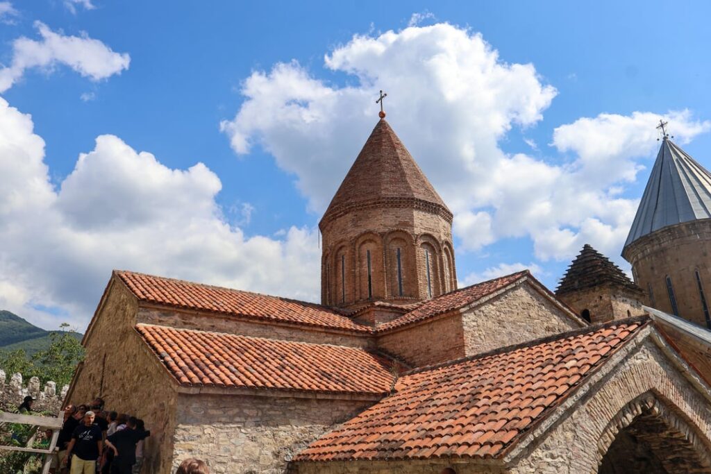 As an amateur historian, I am trying to find the names of these churches inside the Ananuri Fortress in Georgia. But I am unable, so please help me identify.