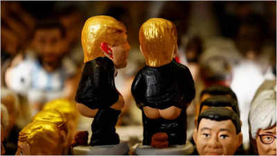 Catalan traditional figurines "caganers" (poopers) including ones representing U.S. President-elect Donald Trump, are displayed in a stall. (Reuters Image) US President-elect Donald Trump figurine reappears in Spain's 'pooper' collection