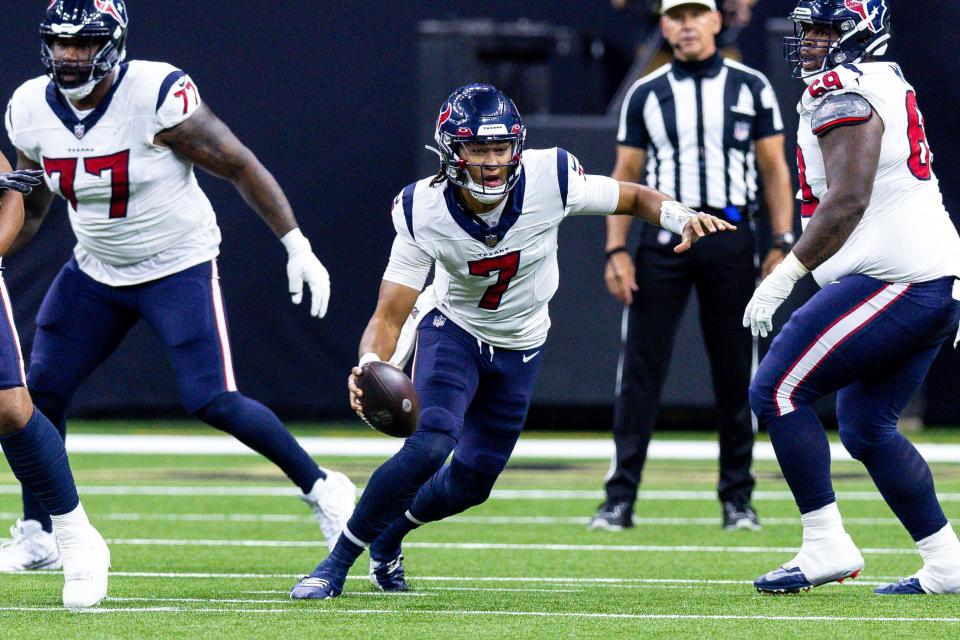 Aug 27, 2023; New Orleans, Louisiana, USA; Houston Texans quarterback C.J. Stroud (7) scrambles out the pocket against the New Orleans Saints during the first half at the Caesars Superdome. Mandatory Credit: Stephen Lew-USA TODAY Sports