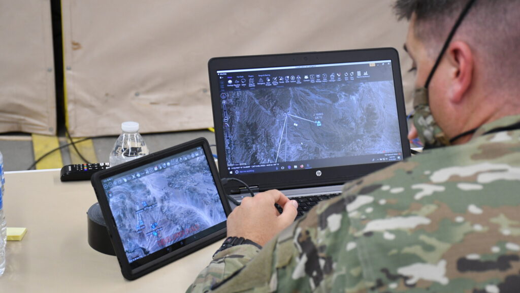 Soldier uses Windows Tactical Assault Kit (WINTAK) and Android Tactical Assault Kit (ATAK)