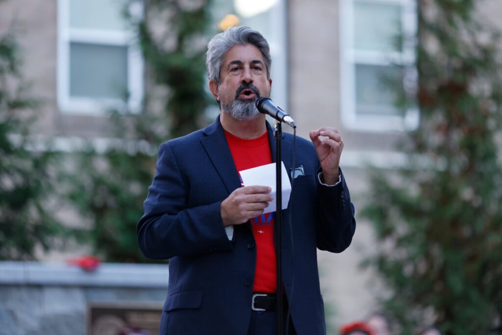 Max Page, President of the MTA, speaks at a demonstration for new teacher contracts and equitable pay for educators in Malden and Haverhill outside of Malden City Hall in Malden, Mass. on Oct. 15, 2022.