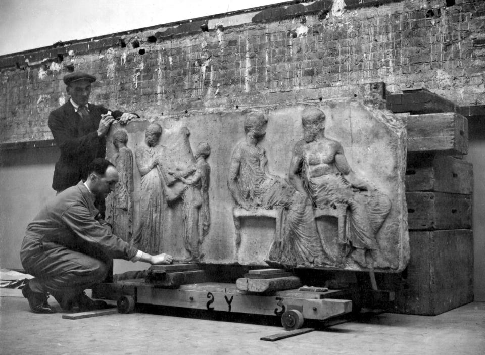The Elgin Marbles, sculptured stones carved 23 centuries ago and forming part of the frieze of the famous Greek Parthenon in Athens, are being brought from their war-time home in a London Underground Railway tunnel, back to the British Museum in London, where, after they have be washed, they will be on general view to the public in six months'time. The picture shows the famous slab of the East Frieze, featuring the Goddess Athena.8 November 1999, new row breaks out as it is revealed that the Duveen room with the Marbles in it can be hired for 35000 pounds.