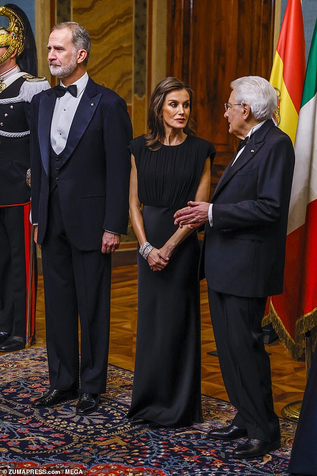 Letizia opted for a smokey make-up look which accentuated her eyes, teamed with a dark lipstick