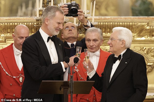 Elsewhere, Felipe, 56, was dapper in a sophisticated tuxedo as he beamed while toasting at the dinner table