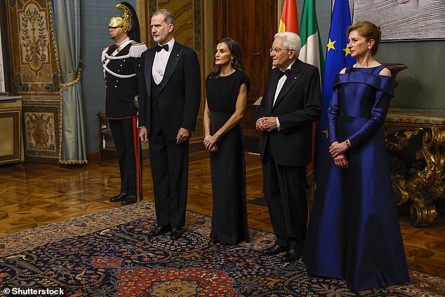 Her chestnut tresses were styled in voluminous waves, made all the more striking with a side part. Pictured left to right: Felipe, Letizia, President Sergio Mattarella and his daughter Laura Mattarella