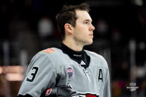 Forward Sam Stange before the game starts during a hockey match at Baxter Arena on Saturday, December 14, 2024, in Omaha, Nebraska. Photo by Collin Stilen. during a hockey match at Baxter Arena on Saturday, December 14, 2024, in Omaha, Nebraska. Photo by Collin Stilen.