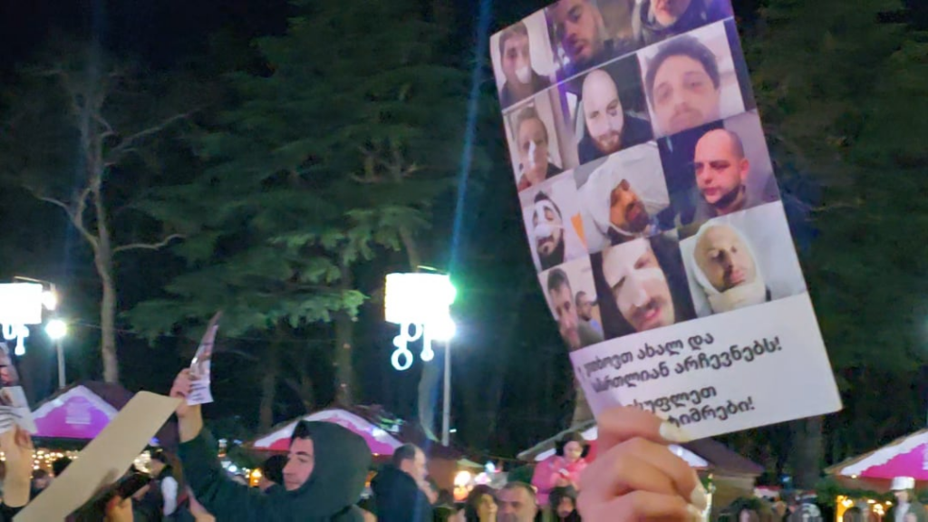 A protest and a concert happening at the same time in Kutaisi.