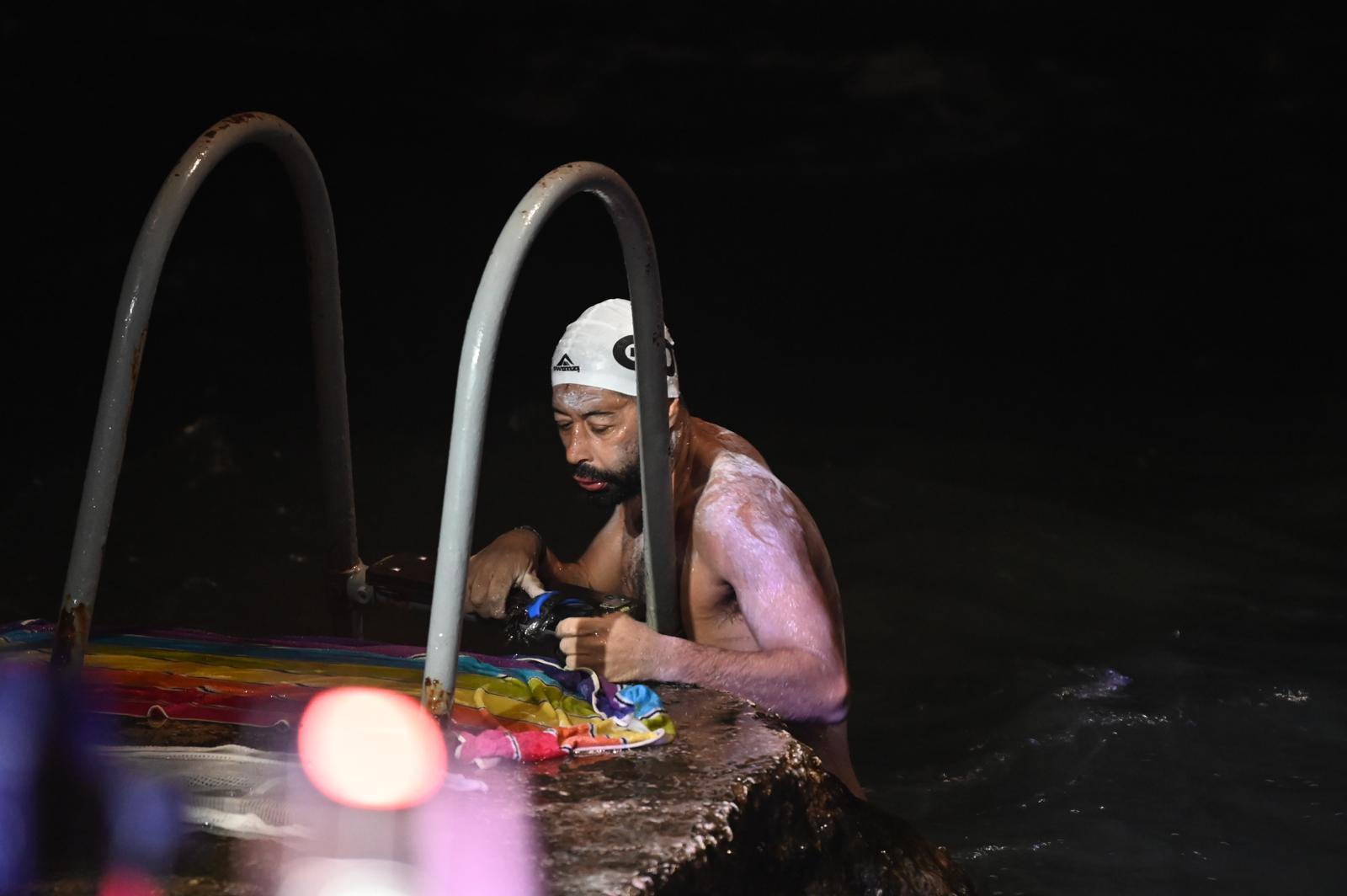 Neil Agius climbs the ladder at Għar Lapsi to end his swim. Photo: Jonathan Borg