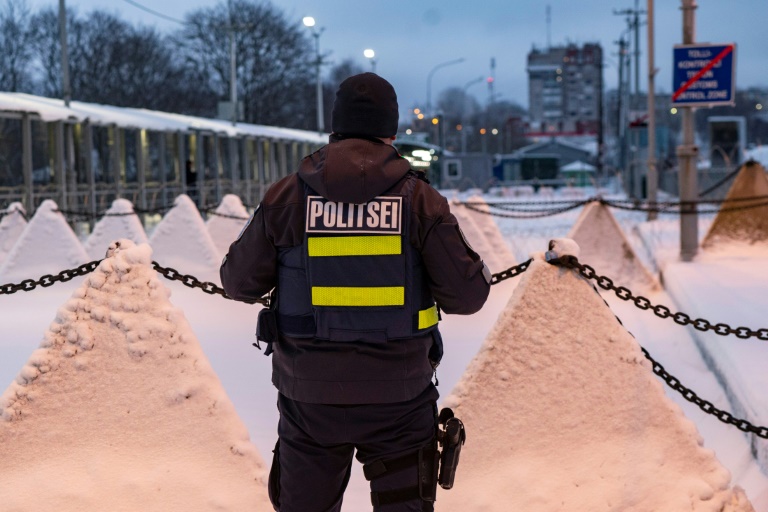 Russia’s shadow looms over Estonian border town A policeman stands next to pyramidal anti-tank obstacles, at the Estonian-Russian border in Narva (Marko Mumm)