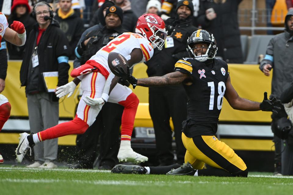 Dec 25, 2024; Pittsburgh, Pennsylvania, USA; Pittsburgh Steelers wide receiver Mike Williams (18) reaches for a pass that fell incomplete in front of Kansas City Chiefs cornerback Joshua Williams (2) )during the second quarter at Acrisure Stadium. Mandatory Credit: Barry Reeger-Imagn Images