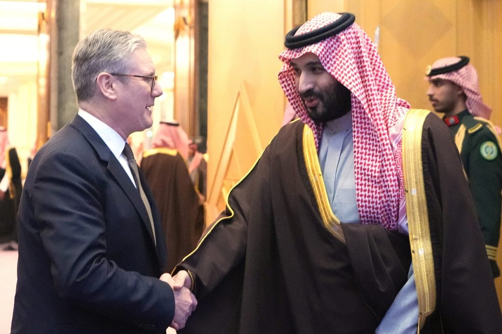 An image of Britain's Prime Minister Keir Starmer, left, shakes hands with Saudi Arabian Crown Prince Mohammed bin Salman Al Saud, right.