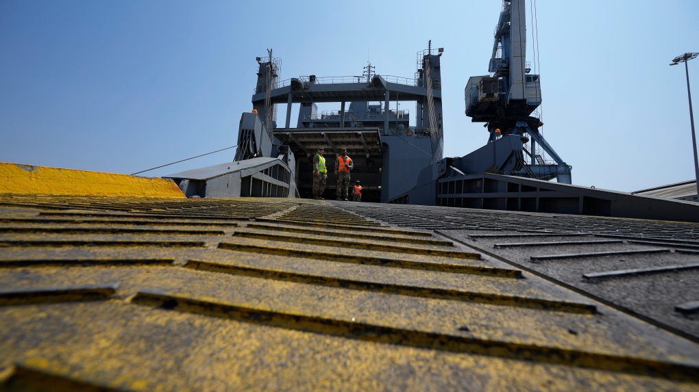Spain reportedly denied port entry to ships carrying arms to Israel U.S soldiers stand on a docked U.S ship that will transport the Gaza aid, at the port in southern city of Larnaca, Cyprus, Wednesday, June 26, 2024. (AP Photo/Petros Karadjias)