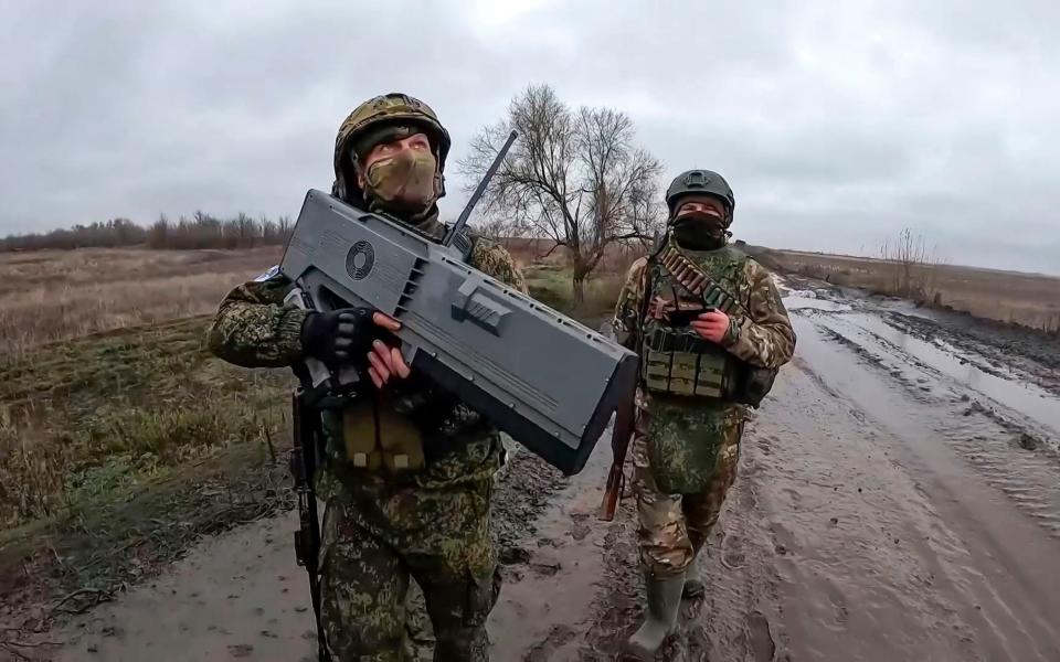 Russian soldiers prepare to shoot Ukrainian drones on an undisclosed location in Ukraine
