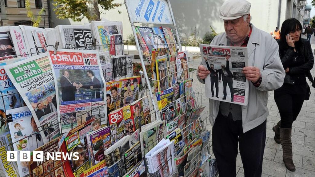 A man reads a newspaper in Georgia's capital Tbilisi, on October 28, 2013