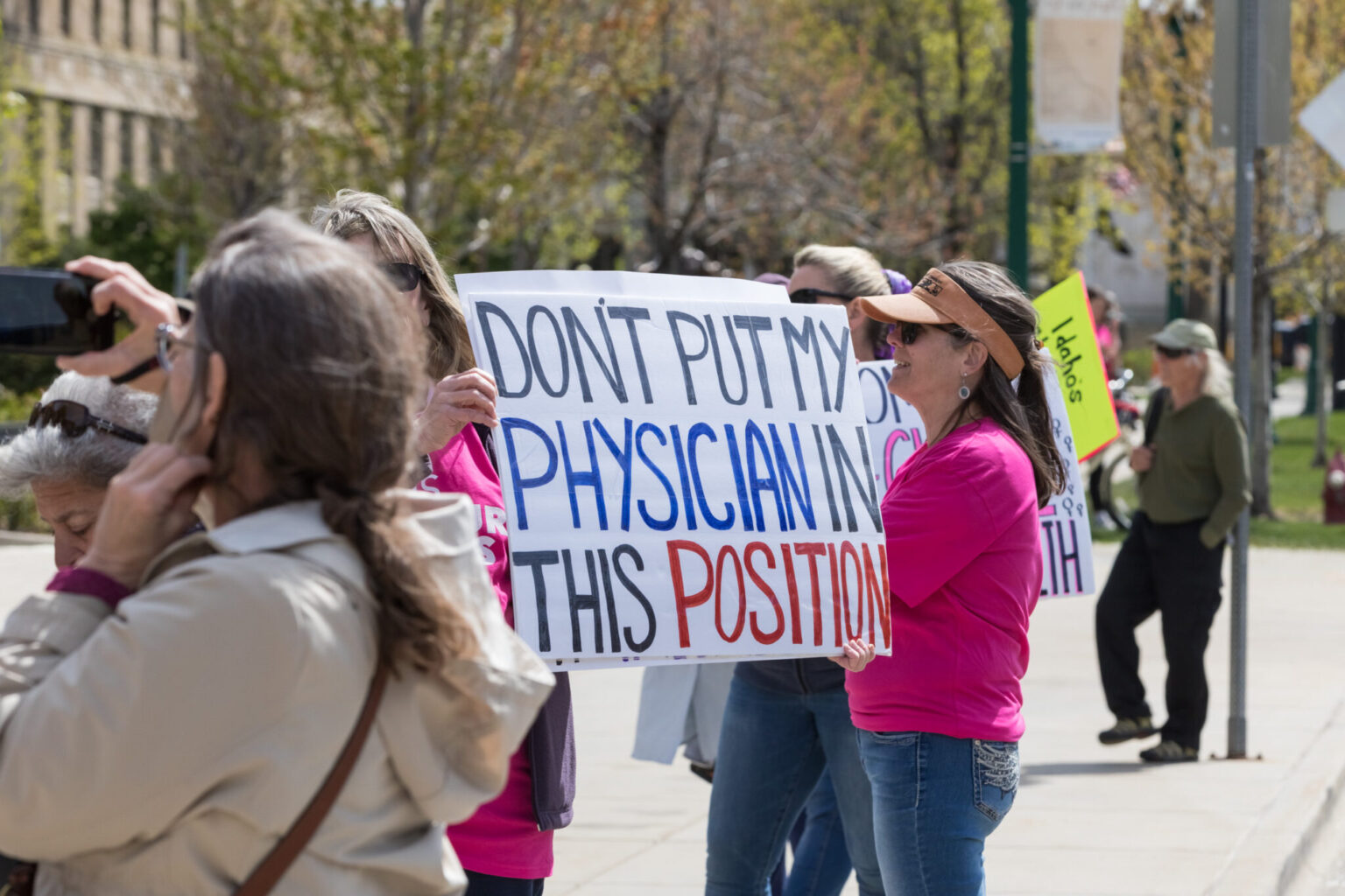 Idaho’s largest health system sues AG, seeking emergency abortion protections • Idaho Capital Sun Supporters hold signs in support of their doctors and abortion access at a rally in Boise, Idaho