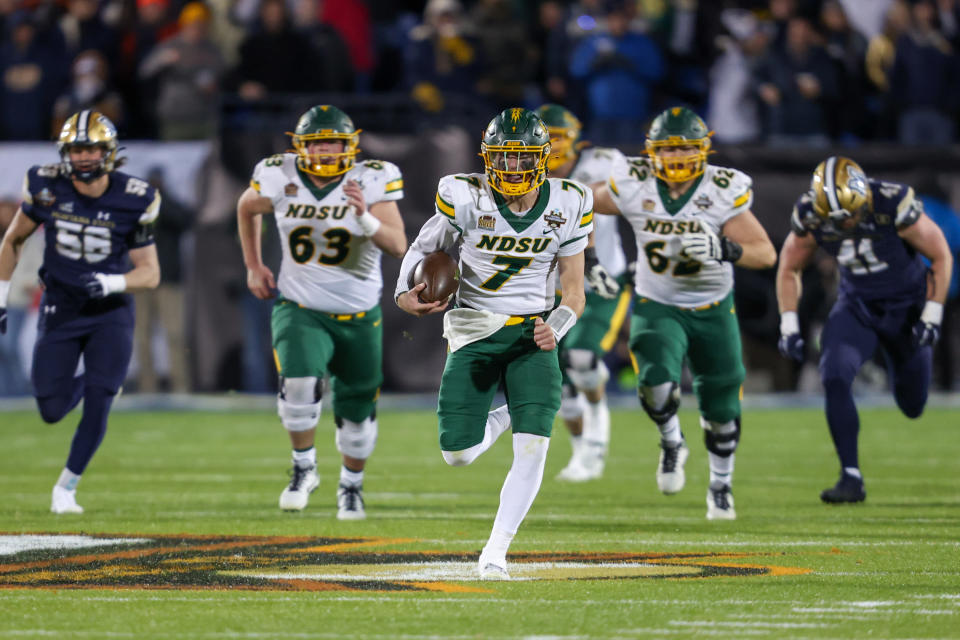 FRISCO, TX - JANUARY 06: North Dakota State Bison quarterback Cam Miller (7) breaks through the line during the FCS Championship game between North Dakota State and Montana State on January 6, 2025 at Toyota Stadium in Frisco, TX. (Photo by George Walker/Icon Sportswire via Getty Images)