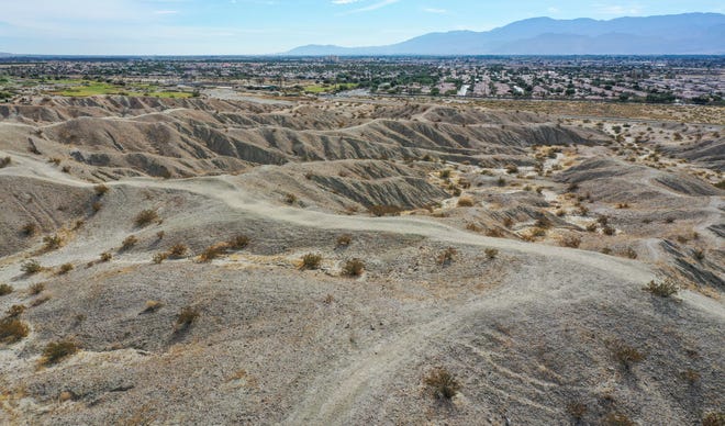 The Indio Hills Badlands Trail stretches across the landscape in north Indio. The trail, which is about five miles long, loops along the San Andreas Fault, and will host the Friends of the Desert Mountains' Full Moon Hike on Monday.