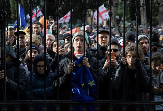 Protestors listening to the speech by outgoing president Salomé Zourabichvili during the inauguration of the new president, Mikheil Kavelashvili, in Tbilisi, December 29, 2024.