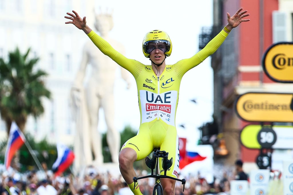 Slovenian cyclist Tadej Pogacar of UAE Team Emirates celebrates as he crosses the finish line to win the final stage of the 2024 Tour de France on July 21, 2024. Photo: DPA