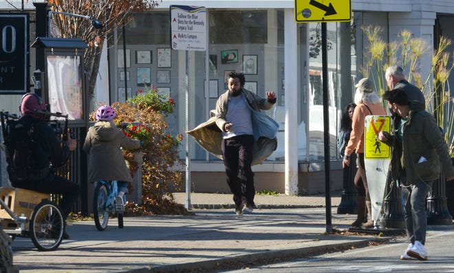 Actor Kunal Nayyar turns the corner from Pearl Street onto Main Street Hyannis in 2021 as a film crew follows him during filming for the movie "The Storied Life of A.J. Fikry" based on the book of the same name. The movie is now streaming on Netflix.