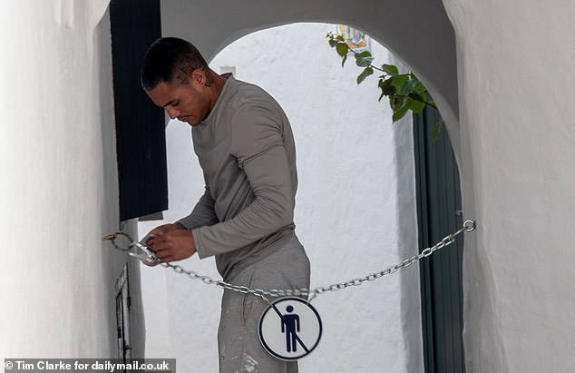 Chains have been introduced across pathways in the village of Binibeca in Menorca to stop visitors intruding in private spaces of residents at certain times
