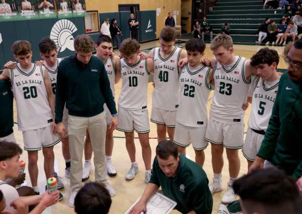 De La Salle's Davit Pachulia, (25) fourth from left, during a timeout in their game against Dublin High at De La Salle High School in Concord, Calif., on Tuesday, Jan. 21, 2025. Pachulia's dad is former Golden State Warriors center Zaza Pachulia, who won two NBA Championships with the team in 2017 and 2018. (Jane Tyska/Bay Area News Group)