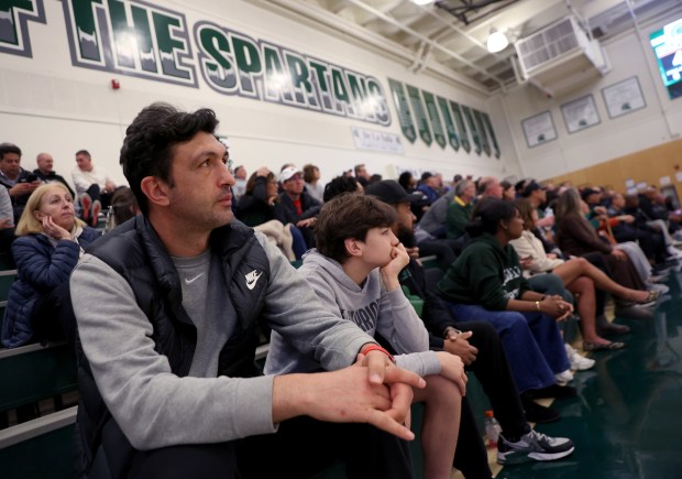 Former Golden State Warriors center Zaza Pachulia and his son Saba, 15, watch his other son, De La Salle's Davit Pachulia (25) play during their game against Dublin High at De La Salle High School in Concord, Calif., on Tuesday, Jan. 21, 2025. (Jane Tyska/Bay Area News Group)