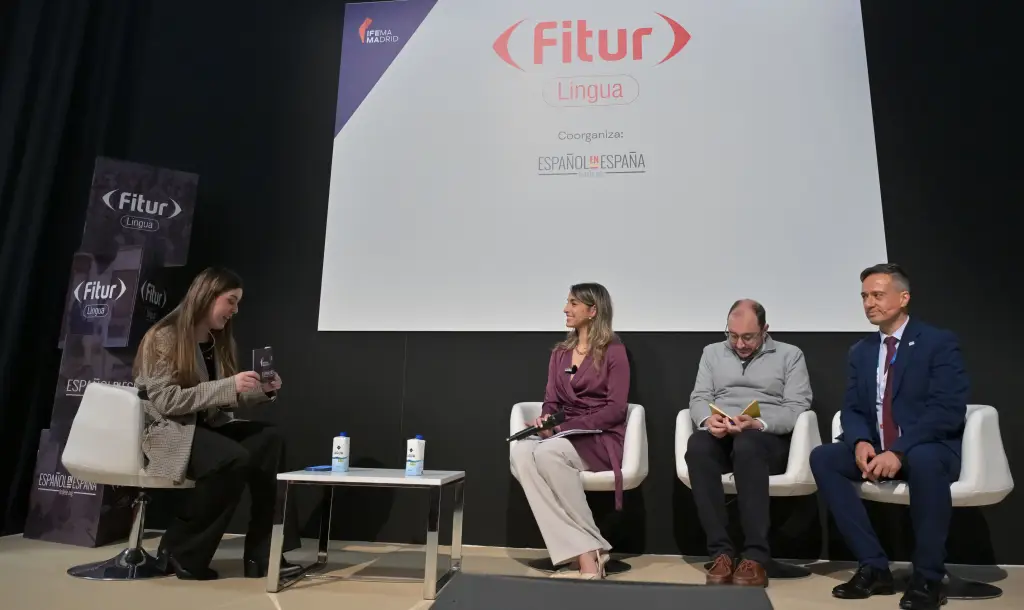 Spain’s Language Tourism: 2024’S €454M Economic Boost 3 Panel discussion at FITUR Lingua featuring four speakers seated on stage with a FITUR Lingua banner in the background.