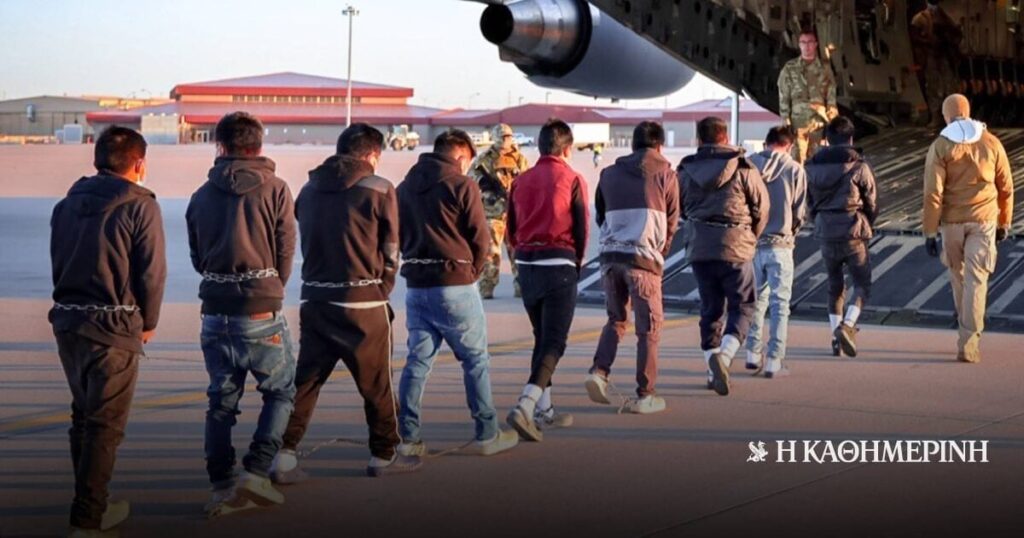 Started deportations - chained immigrants boarding aircraft