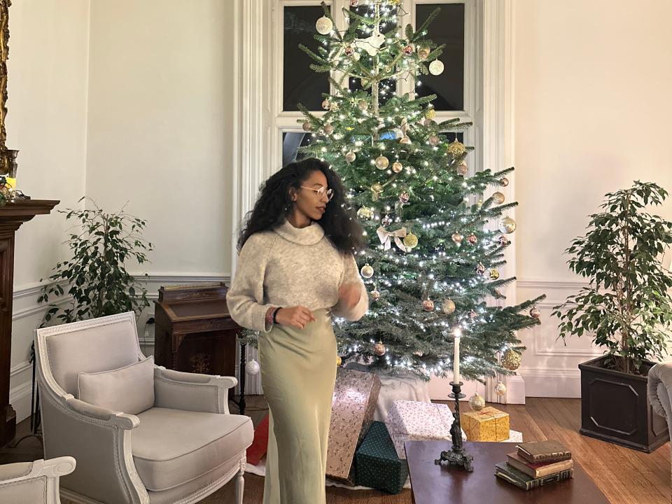 shayna in front of a christmas tree at an estate in west cork